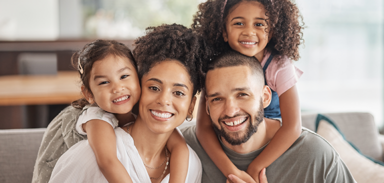 Gen Z black family, mom dad and two young daughters
