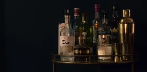 Several bottles of alcohol on a bar