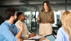 Multicultural Gen Z business people around a conference table
