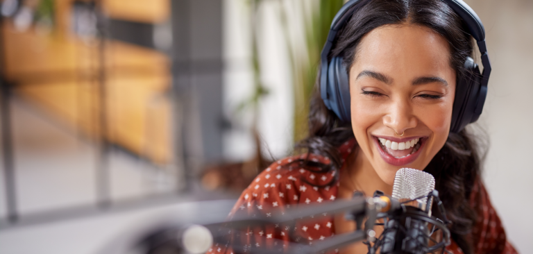 Woman on podcast microphone